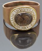 Georgian mourning ring set with plaited hair in a glass compartment surrounded by white enamel