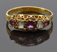 Victorian 15ct gold ring set with garnets and quartz, with a chased band, Birmingham 1873, size S