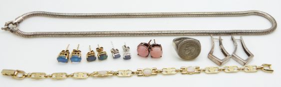 Four pairs of silver earrings set with various opals, an opal bracelet, silver earrings and silver