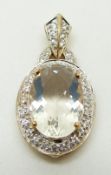 A 9ct gold pendant set with an oval cut ice opal surrounded by zircon, 3.2g