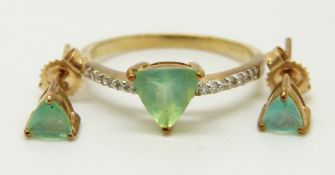 A 9ct gold ring set with a trilliant cut Paraiba opal and diamonds, with a pair of similar earrings,