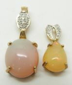 Two 9ct gold pendant set with an opal cabochon and diamonds