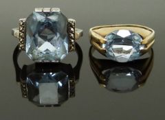 A 9ct gold ring set with an aquamarine and a silver ring with blue topaz, size G & I