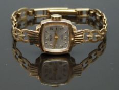 Avia 9ct gold ladies wristwatch with 9ct gold hands and markers, silver dial and 17 jewel