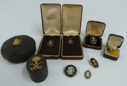 Two Wedgwood silver gilt pendants and brooches set with black basalt cameos, silver Wedgwood