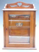 Glazed Art Nouveau mahogany smoker's cabinet with fitted interior including a revolving lower