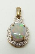 A 9ct gold pendant set with a black opal and diamonds, 1.7g