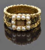 Georgian / Victorian mourning ring set with pearls and black enamel to the band reading 
