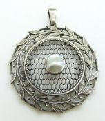 Arts and Crafts silver pendant with lattice and foliate decoration set with a pearl, 3.8cm diam