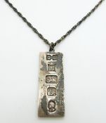 A hallmarked silver ingot pendant on silver chain