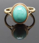 A 9ct gold ring set with a turquoise cabochon, size L/M, 2.06g