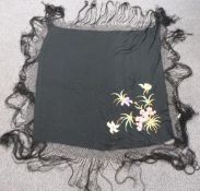 A 19th/20thC Chinese black shawl with embroidered floral decoration and fringe, 180 x 180cm