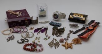 A collection of costume jewellery including amethyst, beaded necklaces, vintage brooches, etc