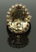 A 9ct gold ring set with a large oval cut quartz, size R, 7.91g