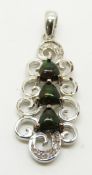 A 9ct white gold pendant set with three trilliant cut Mezezo opal cabochons and diamonds, 4.1g