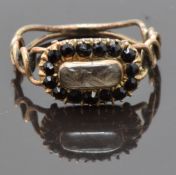 Georgian mourning ring set with plaited hair in a glass compartment surrounded by French jet, size