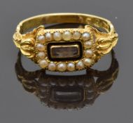 William IV 18ct gold mourning ring set with hair in a glass compartment surrounded by seed pearls,