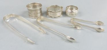 Three sets of hallmarked silver sugar tongs including a Georgian bright cut pair together with three