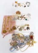 A collection of costume jewellery including vintage brooches, 9ct gold earrings, necklaces etc