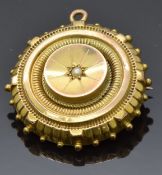 Victorian mourning brooch set with a pearl to the centre, verso a glass compartment, 2.7cm diameter,