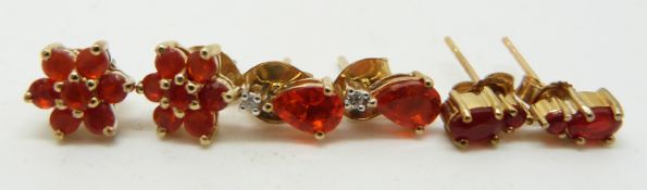 Three pairs of 9ct gold earring set with fire opals, 3.3g