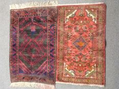 A Persian geometric rug with brown ground, canavar ayagi pattern to central field and bereket motifs