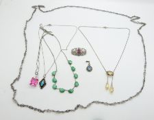 A silver necklace set with cirtine, a paste brooch, a white metal fob chain and other necklaces