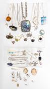 A collection of silver jewellery including abalone pendant, six silver rings, earrings, four
