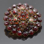 Victorian brooch set with bohemian cut garnets, 2.8cm diameter