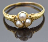 Victorian yellow metal ring set with split pearls and old cut diamonds in the form of a clover, size