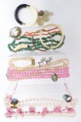 A collection of jewellery including rose quartz, adventurine quartz, vintage glass necklace, coral