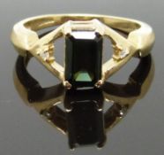 A 9ct gold ring set with an emerald cut tourmaline and diamonds, size M/N, 3.36g