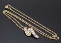 A 9ct gold pendant set with topaz on a 9ct gold chain, 3.4g