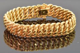 An 18ct gold bracelet made up of rope twist links, with six spare links, 50.8g
