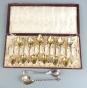 Cased set of 12 gilt metal spoons and two Swedish silver spoons, weight 43g