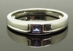 A 9ct white gold ring set with a square cut tanzanite, size N, 2.81g