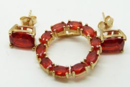 A 9ct gold pendant set with oval cut Salamanca fire opal and a similar pair of earrings, 4g