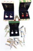 Three sets of novelty cufflinks and 20 keyrings made from rifle cartridges/ bullets.