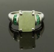 A 9ct white gold ring set with a hardstone and emeralds, size J, 3.09g