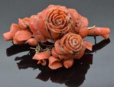 Victorian carved coral brooch in the form of roses, 7 x 4cm