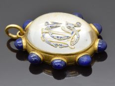 Victorian double sided locket set with enamel initials under a glass cabochon and lapis lazuli