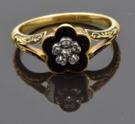 Victorian 18ct gold ring set with black enamel and old cut diamonds in a flower setting, verso a