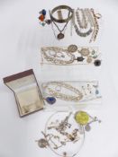 A collection of silver and paste jewellery including ingot, thimble, St Christoper, bangle,