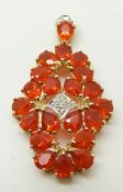 A 9ct gold pendant set with pear cut fire opals and diamonds, 4.4g