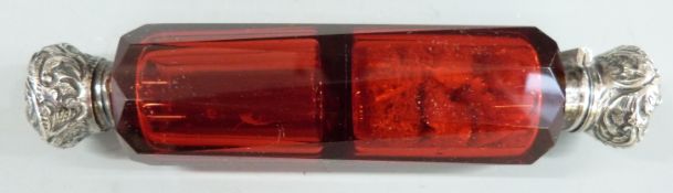 Double ended cranberry glass scent bottle with white metal mounts, length 13cm