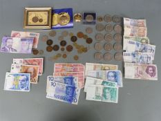 A collection of various UK and overseas coinage and modern crowns including Spitfire and Wright