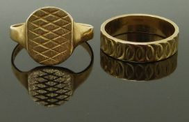 A 9ct gold ring and a 9ct gold signet ring with textured decoration, size O/P & V, 6.37g
