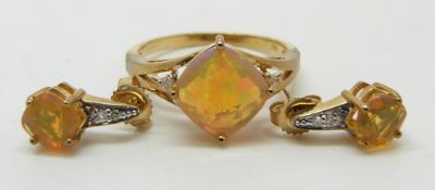 A 9ct gold ring set with a cushion cut Indonesian opal and diamonds (size N) and a pair of