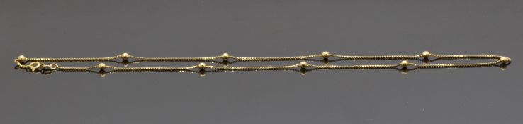 An 18ct gold necklace made up of square links with sphere decoration, 5.1g