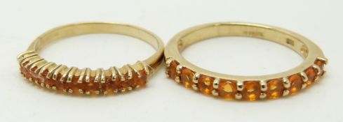 Two 9ct gold half eternity rings set with fire opals, 3.5g, size M & N